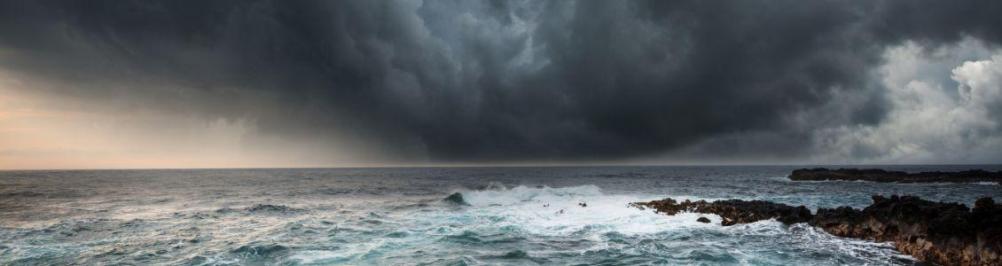 Storm clouds on rugged coastline